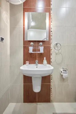 a bathroom with a sink and a mirror at The Love Nest - 1BD Apartment in Sunny Beach by Flat Mаnаger in Sunny Beach