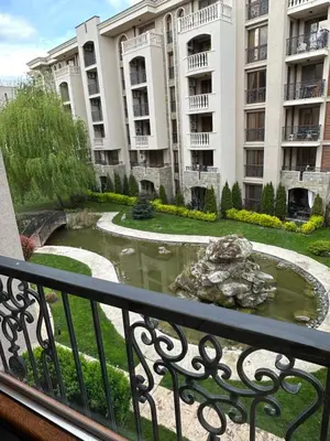 a view from a balcony of a building with a pond at Apartament CASCADAS FAMILY in Sunny Beach