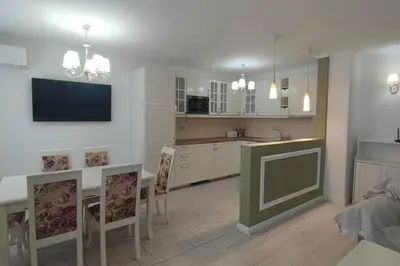 a kitchen and dining room with a table and chairs at Sea angel in Burgas City