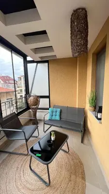 a living room with a couch and a table at SOS CoMFORT 2 LAZUR in Burgas City