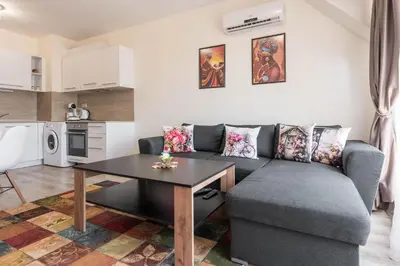 a living room with a couch and a table at Casa de la playa in Varna City