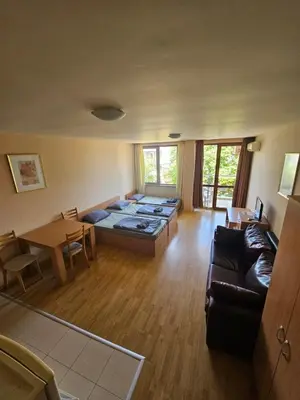 a living room with a couch and a table at VV Vigo Apartments in Nesebar