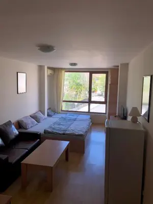 a living room with two beds and a couch at VV Vigo Apartments in Nesebar