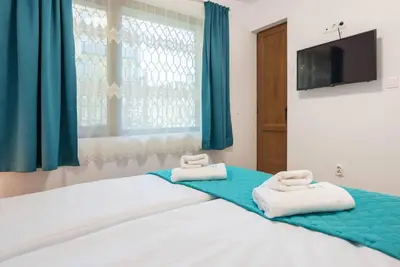 a bedroom with a bed with two towels on it at Peaceful Central Place - Vazov street in Varna City