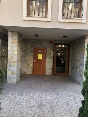 a entrance to a building with a wooden door at Private Studio Sunny Beach- Cascadas in Sunny Beach