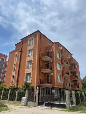 a tall building with balconies on the side of it at A Tiny Flat in Sunny Beach