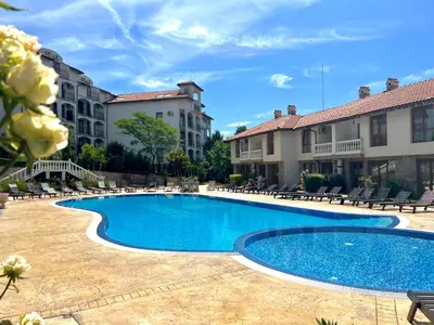 a swimming pool in the middle of a courtyard at Apartment Marina beach k-s Triumph in Sveti Vlas