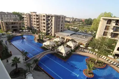 an overhead view of two pools in a resort at Deluxe Appartements in Cascadas Family Resort Sunny Beach in Sunny Beach