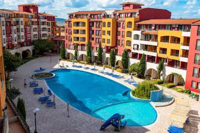 a swimming pool in the middle of some buildings at Sea View Apartments - Aheloy in Ravda