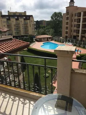 a balcony with a view of a pool and buildings at 3 Bedroom Apt with Pool Views at Arcadia Complex in Sunny Beach