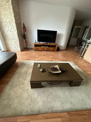 a living room with a coffee table and a flat screen tv at Central, 3 Bedroom Apartment at Golden Fort Complex in Sunny Beach
