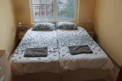 a bed in a bedroom with two pillows on it at Spacious, 1 Bed Apt, Dawn Park in Sunny Beach