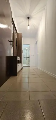 an empty room with a hallway with a door and a counter at Studio Nina in Primorsko