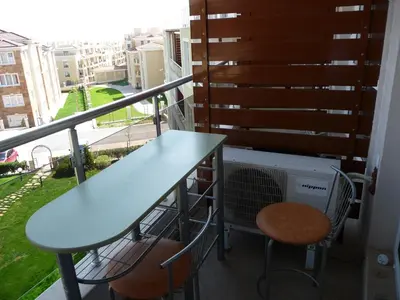a balcony with a table and two chairs at Great Choice Apartment in Chernomorets