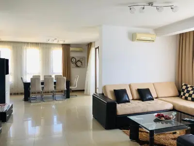 a living room with a couch and a table at Mia Cassa in Sveti Vlas
