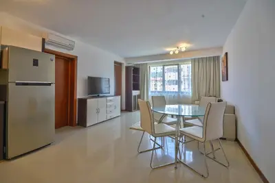 a kitchen and dining room with a table and chairs at Mia Cassa in Sveti Vlas