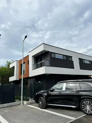 a black limousine parked in front of a building at Villas Park Lozenets in Lozenets