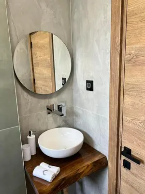a bathroom with a white sink and a mirror at Villas Park Lozenets in Lozenets