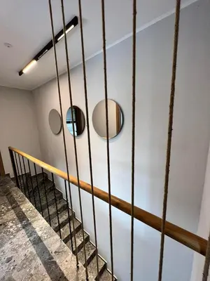 a staircase with two mirrors on the wall at Villas Park Lozenets in Lozenets