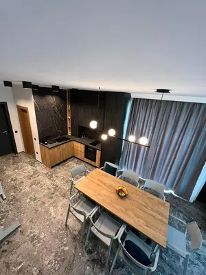 a conference room with a wooden table and chairs at Villas Park Lozenets in Lozenets