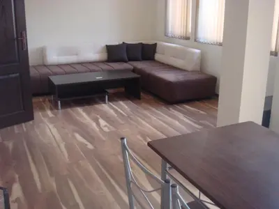 a living room with a couch and a table at Ivatea Family Hotel in Ravda