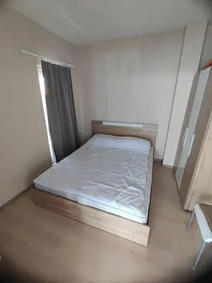 a small bedroom with a bed in a room at The View Apartment in Sozopol