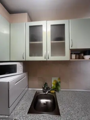 a kitchen with a sink and a microwave at Elit 4 Apartments in Sunny Beach