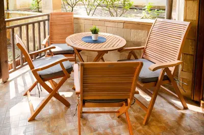 a patio with two chairs and a table on a balcony at Cozy Home Santa Marina Sozopol in Sozopol