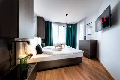 a bedroom with a large bed in a room at Stylish Sea View Apartment 3 Min to Beach Balcony & Comfort in Pomorie