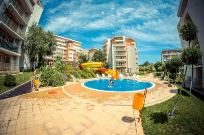 a swimming pool in the middle of a city at Imperial Fort Club Apartament in Sveti Vlas