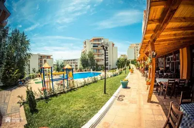 a resort with a swimming pool in a city at Imperial Fort Club Apartament in Sveti Vlas