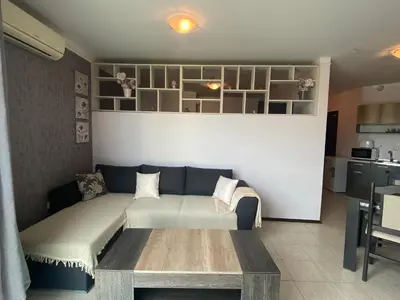 a living room with a couch and a table at SUNNY BEACH PLAZA 4-34 Apartment in Sunny Beach