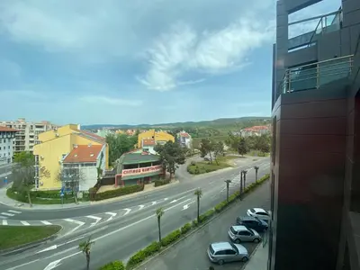 a view of a street with cars parked on the road at SUNNY BEACH PLAZA 4-34 Apartment in Sunny Beach