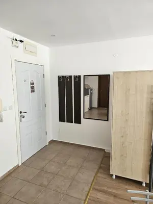 a room with white walls and a door and mirrors at Apartment Fort Noks in Sveti Vlas