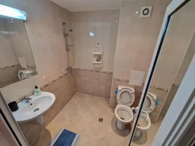 a bathroom with a sink and a toilet and a shower at Aqua Dreams A4, Sveti Vlas , A much sought after complex. in Burgas City