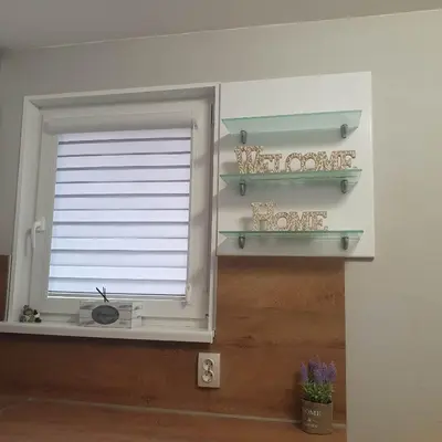 a window in a room with shelves and a window at Apartment Voivoda in Varna City