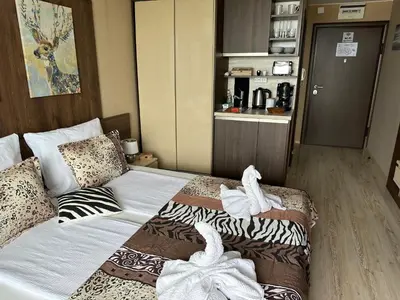 a bedroom with a bed with towels on it at Sea View Private Studio Paradiso B 508 in Nesebar