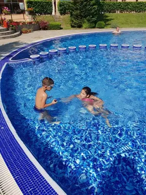 two children are playing in a swimming pool at Sozopoli Hills Apartment А4 in Sozopol