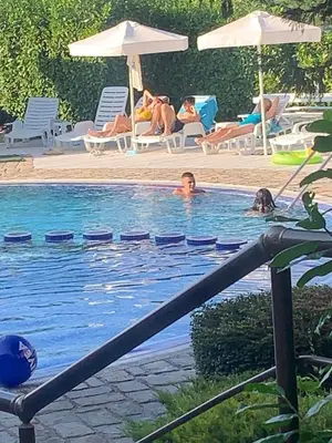 a group of people swimming in a swimming pool at Sozopoli Hills Apartment А4 in Sozopol