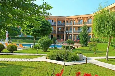 a building with a garden and a swimming pool at Sozopoli Hills Apartment А4 in Sozopol
