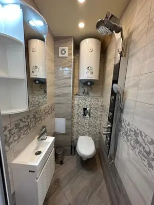 a bathroom with a white toilet and a sink at Lovely studio in Burgas in Burgas City
