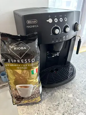 a coffee maker with a bag of coffee and a bag of coffee beans at Lovely studio in Burgas in Burgas City
