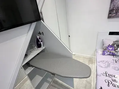 a small room with a chair and a tv at Lovely studio in Burgas in Burgas City