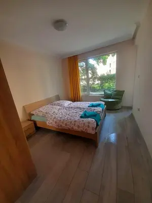 a bedroom with a bed and a window at YASSEN APARTMENT CLOSE TO SEA And Central in Sunny Beach