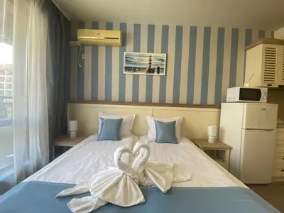 a bedroom with two beds with bows on them at PANORAMA BAY 20 Fancy Studio in Sveti Vlas