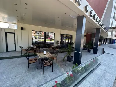 a restaurant with tables and chairs in a building at One Bedroom Private Apartment Paradiso B 501 in Nesebar