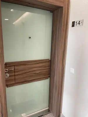 a glass door of a bathroom with a sign on it at Panoramic apartment in Varna with underground parking in Varna City