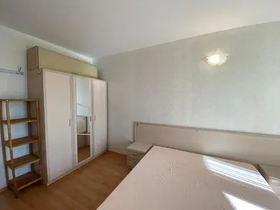 a bedroom with a white bed and a closet at RUTLAND BEACH C8 Two Bedroom Apartment Ravda in Ravda