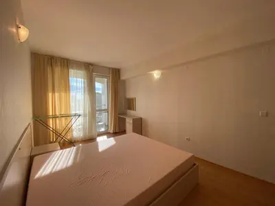 a large white bedroom with a bed and a window at RUTLAND BEACH C8 Two Bedroom Apartment Ravda in Ravda