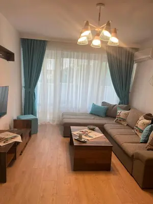 a living room with a couch and a table at Deni's Apartment by the sea – Burgas in Burgas City